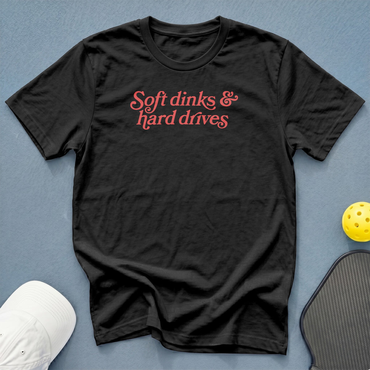 Black t-shirt with red text "Soft dinks & hard drives"