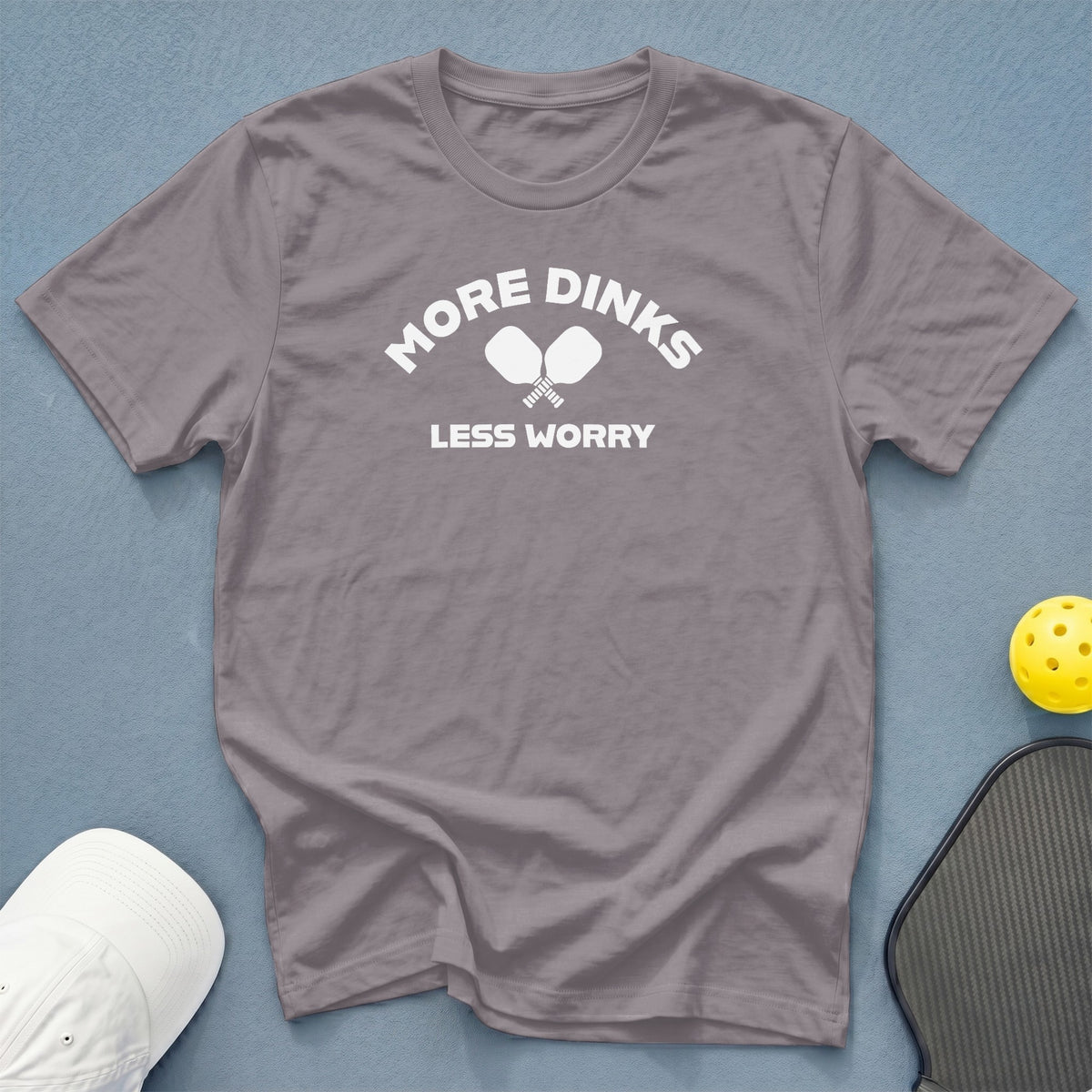 Grey t-shirt with white text and pickleball paddles that reads "More Dinks Less Worry".