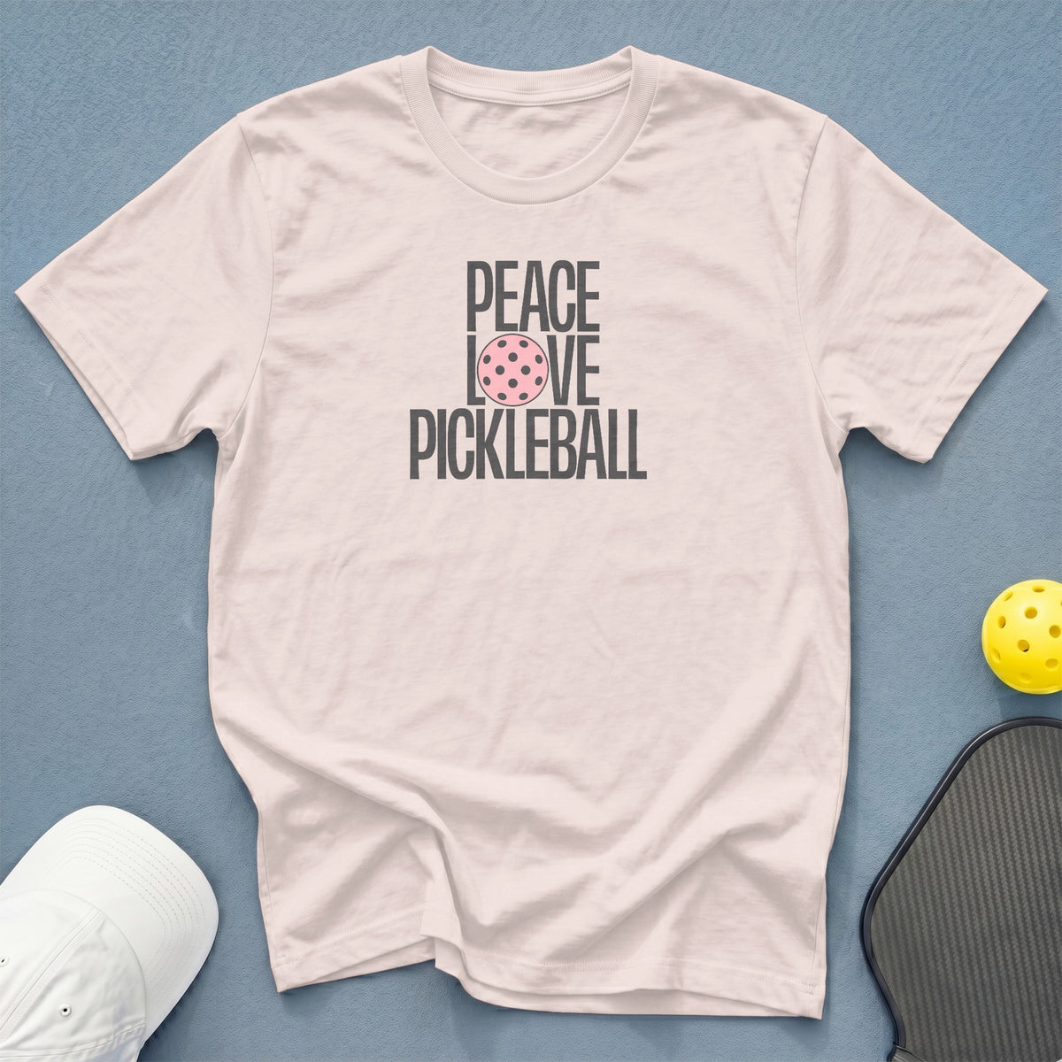 Light pink t-shirt with "PEACE LOVE PICKLEBALL" text and a pickleball graphic.