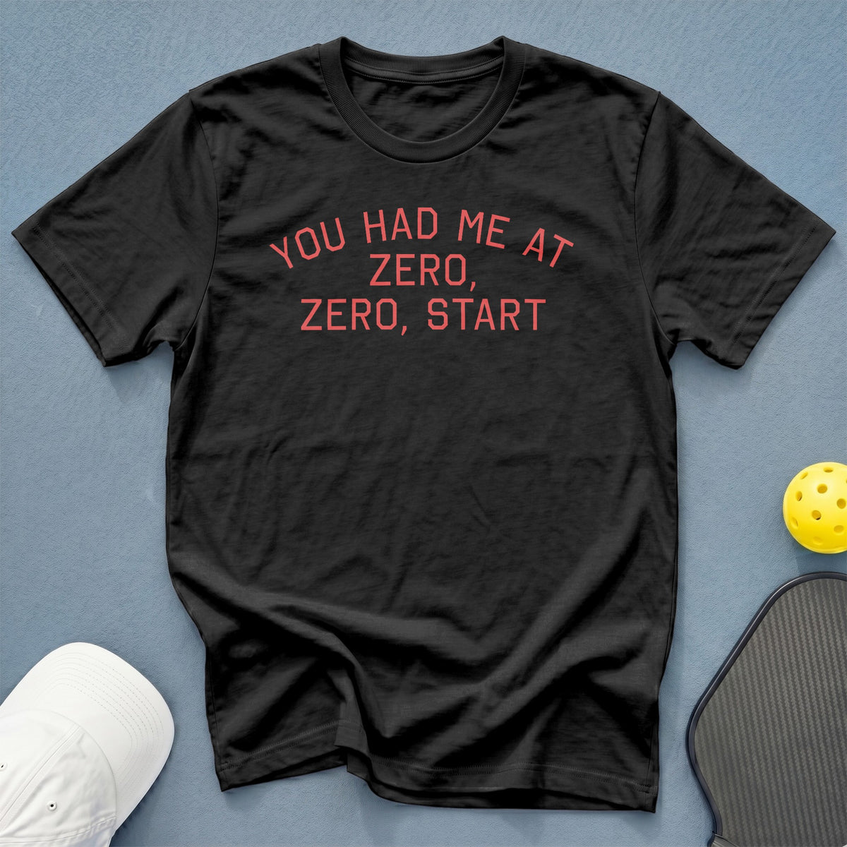 Black t-shirt with red text "YOU HAD ME AT ZERO, ZERO, START".