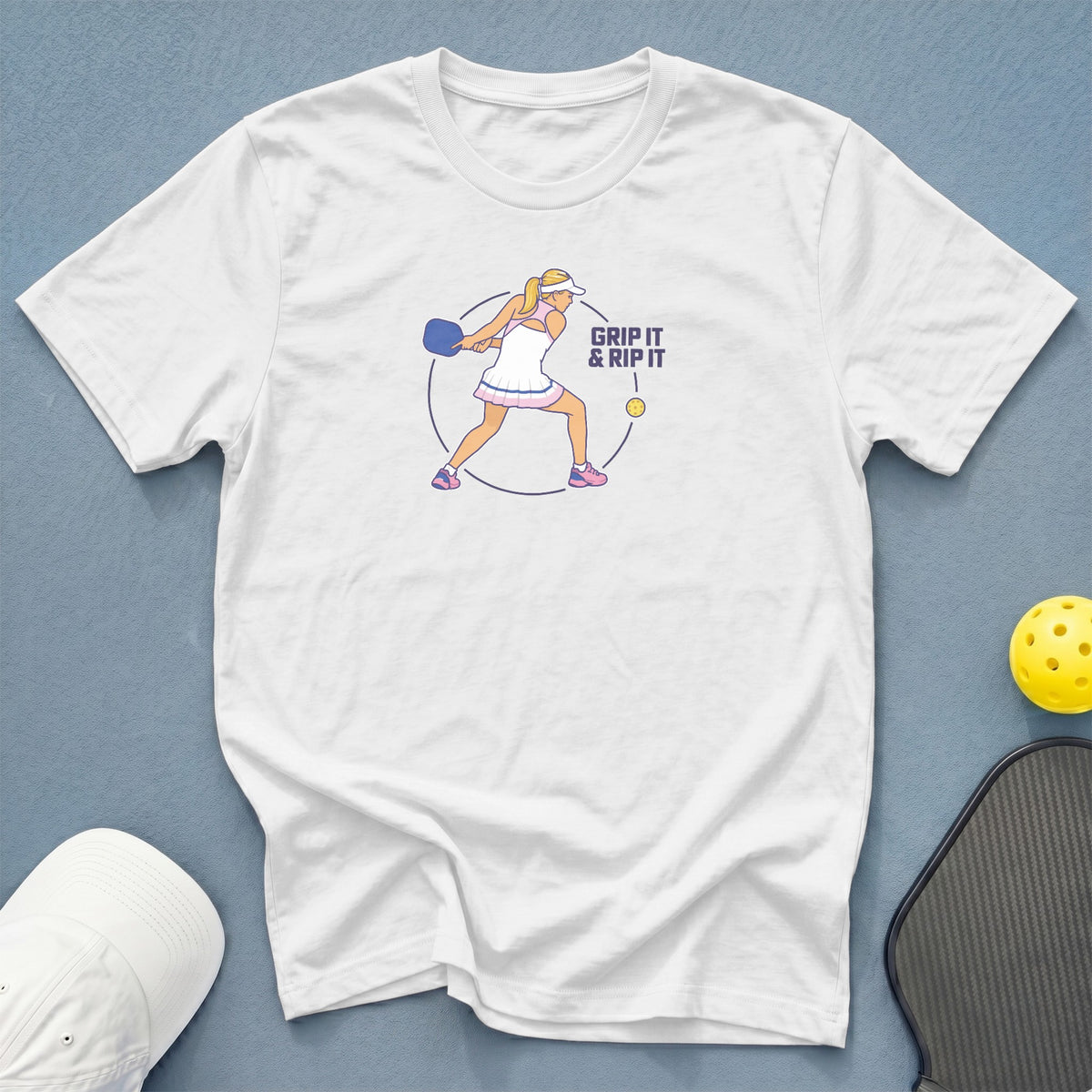 White t-shirt with pickleball graphic saying "Grip It & Rip It".