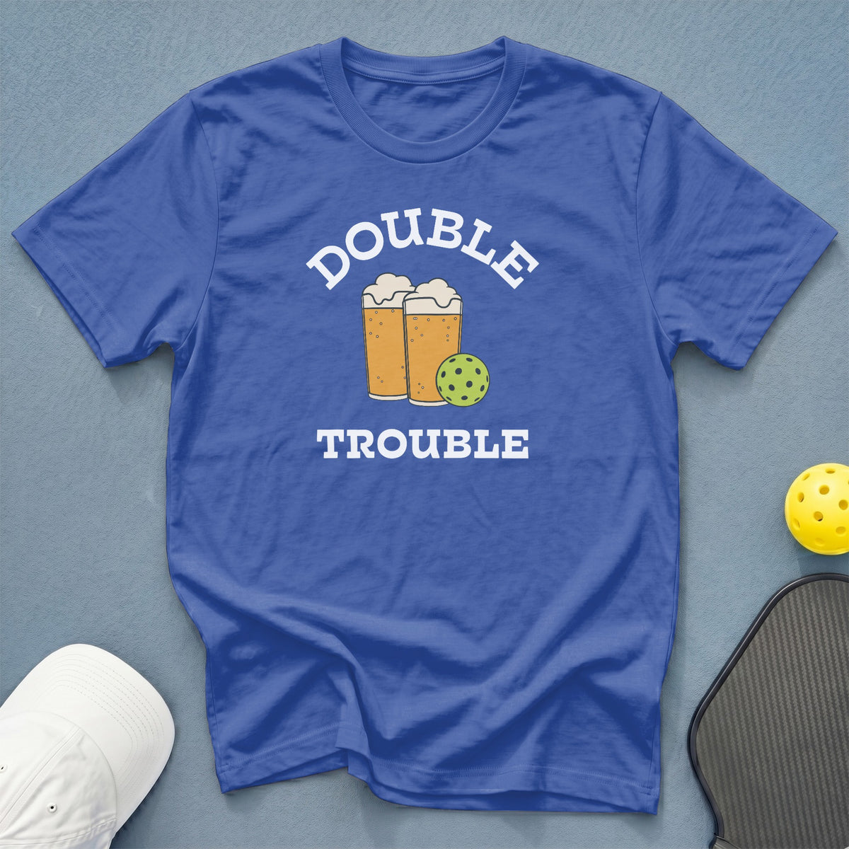 Royal blue t-shirt with "Double Trouble" text, featuring cartoon beer glasses and pickleball.