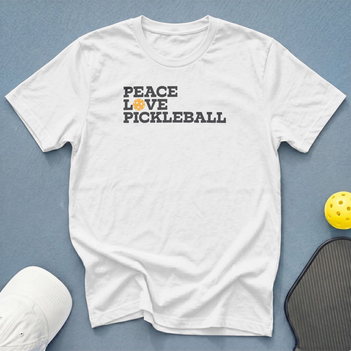 White t-shirt with "Peace Love Pickleball" graphic and pickleball elements.