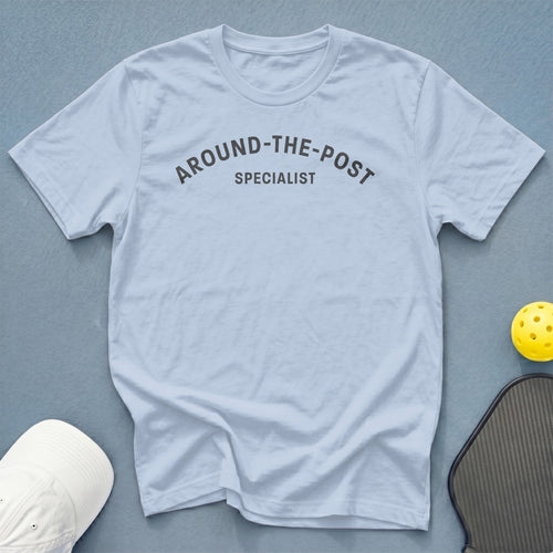 Light blue t-shirt with dark gray text reading "AROUND-THE-POST SPECIALIST".