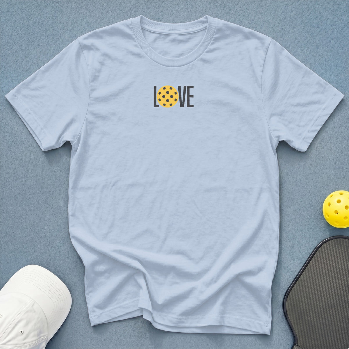 Light blue t-shirt with the word "LOVE" and a pickleball.