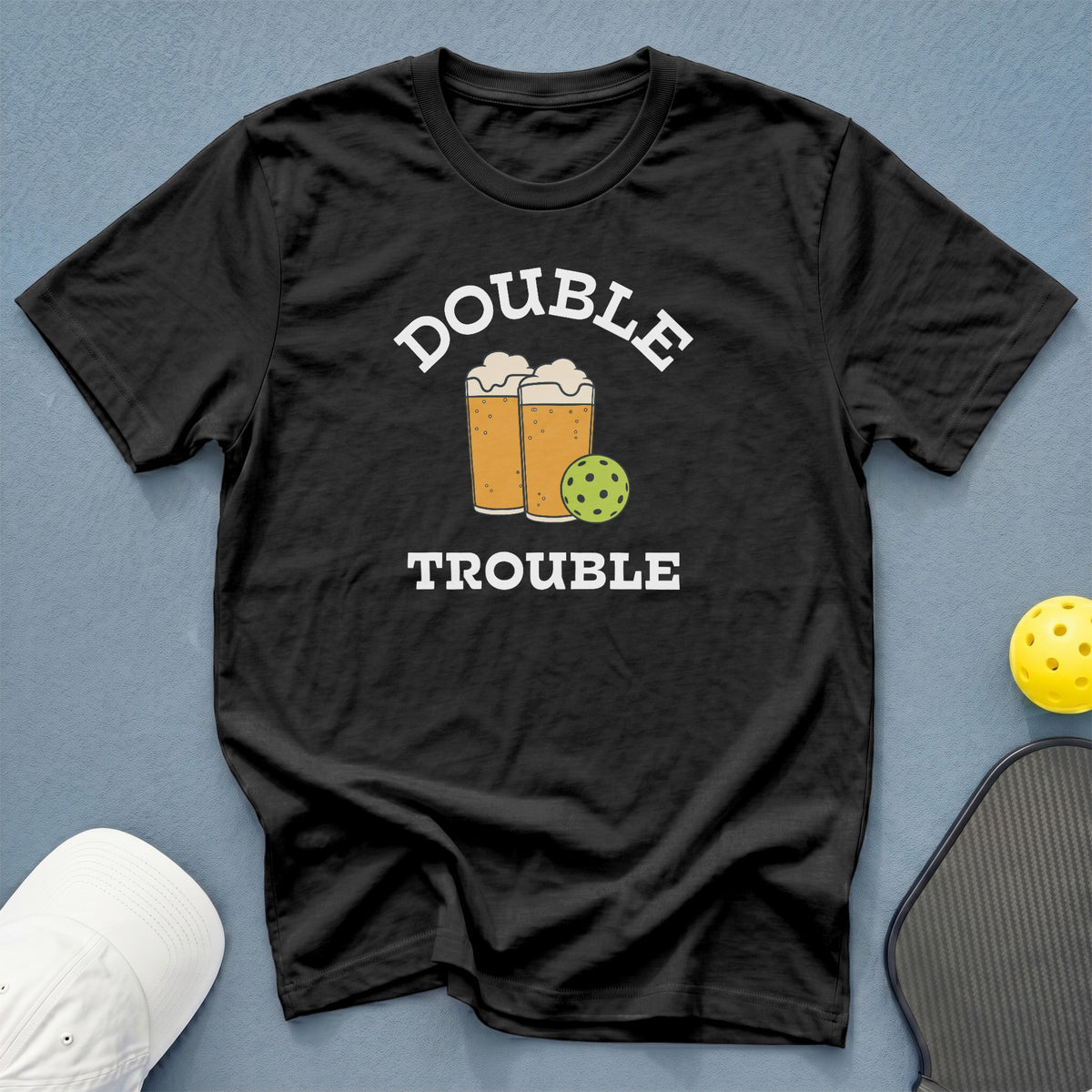Black crewneck t-shirt featuring the text Double Trouble, two beers, and a pickleball.