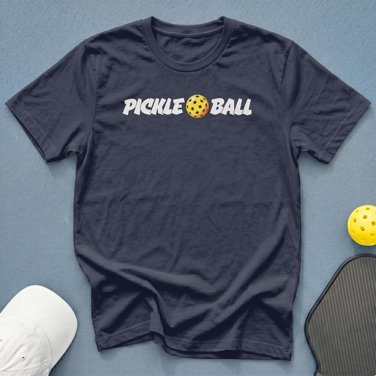 Dark navy t-shirt with white "PICKLE BALL" text and pickleball graphic.