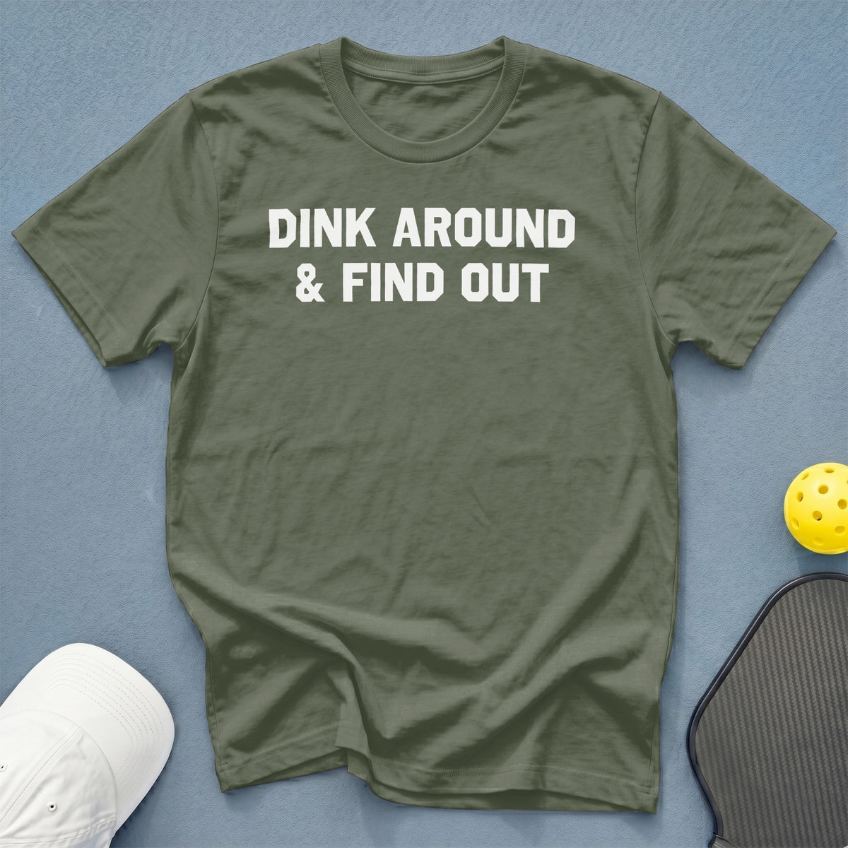 Olive t-shirt with white text "DINK AROUND & FIND OUT".