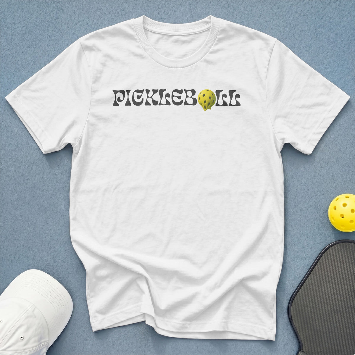 White t-shirt with "PICKLEBOLL" text and a pickleball graphic.