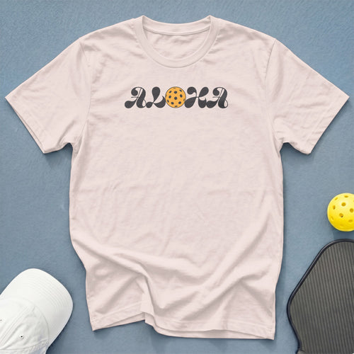 Pale pink t-shirt with "ALOHA" text and pickleball graphic.