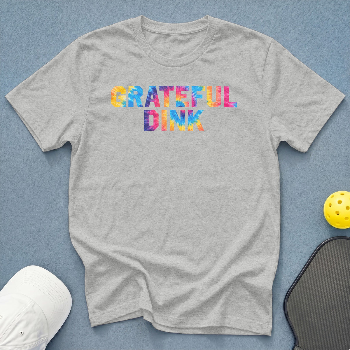 Grey t-shirt with "GRATEFUL DINK" in colorful tie-dye lettering.