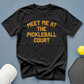 Black t-shirt with orange text reading "Meet Me At The Pickleball Court".