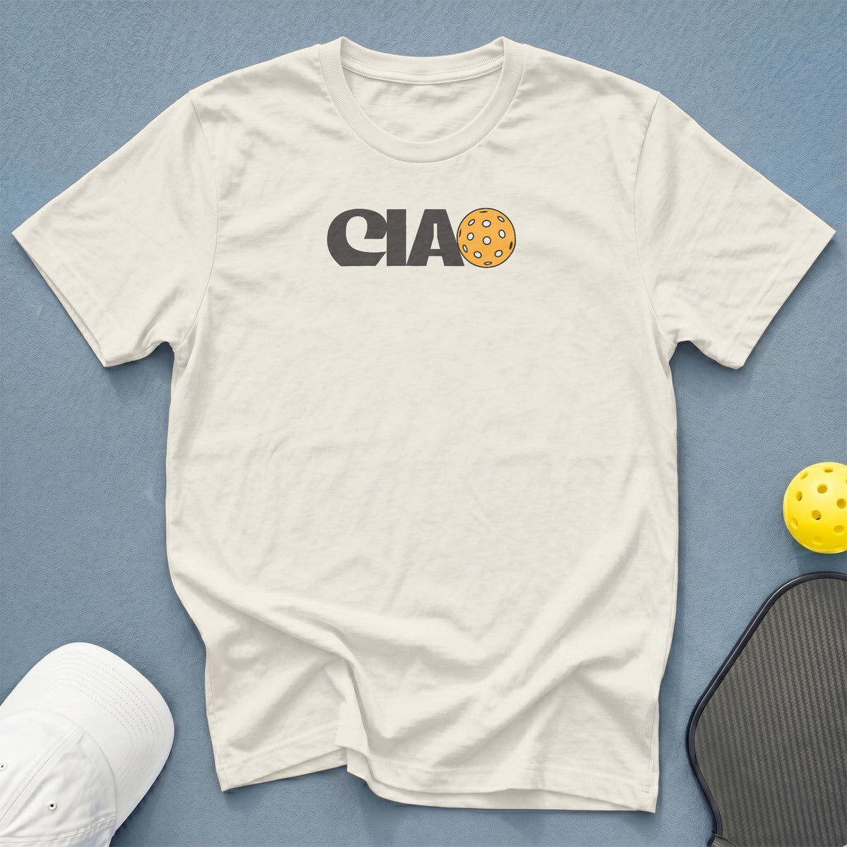 White t-shirt with "CIA" text and pickleball graphic.
