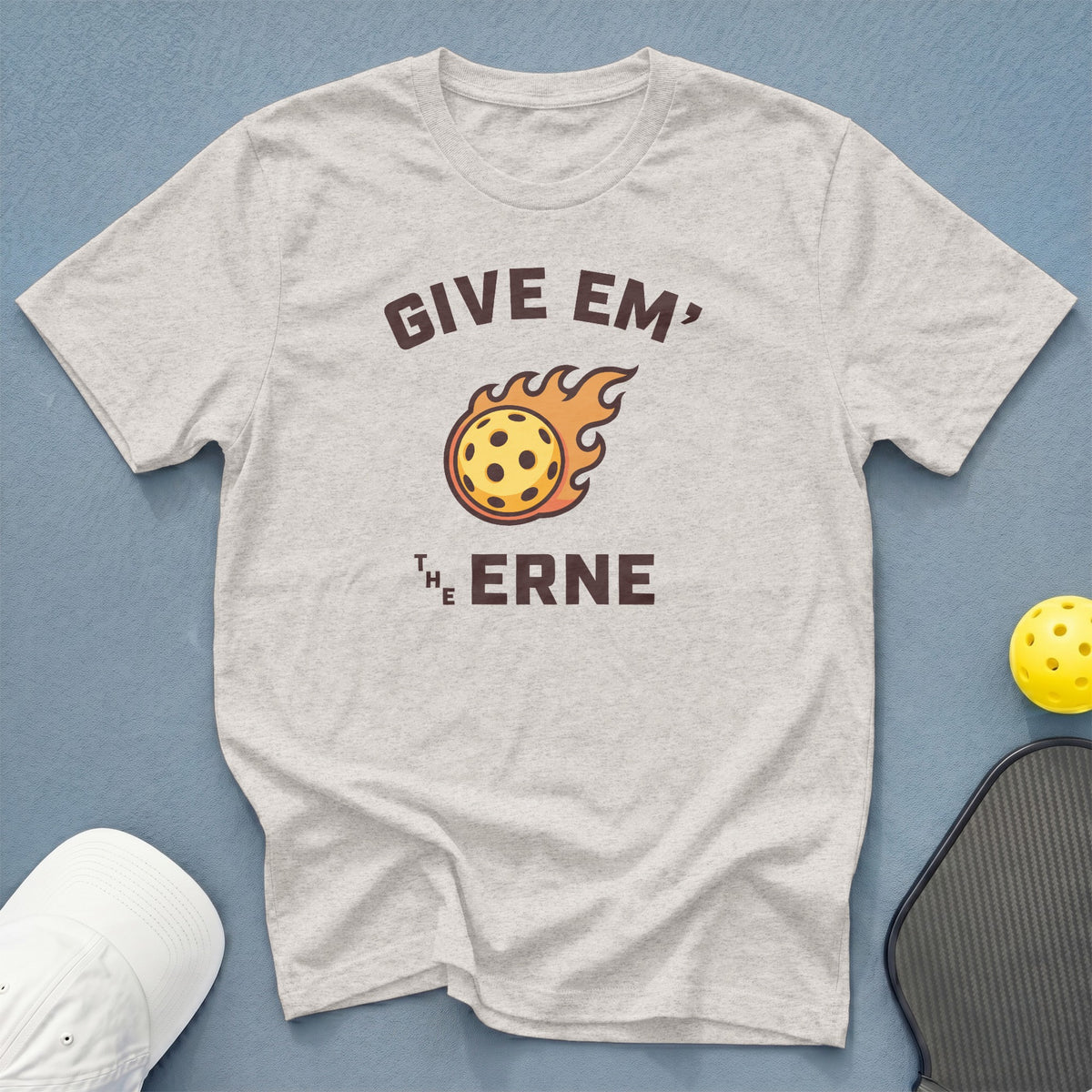 Light grey t-shirt with "GIVE EM' THE ERNE" text and flaming pickleball graphic.