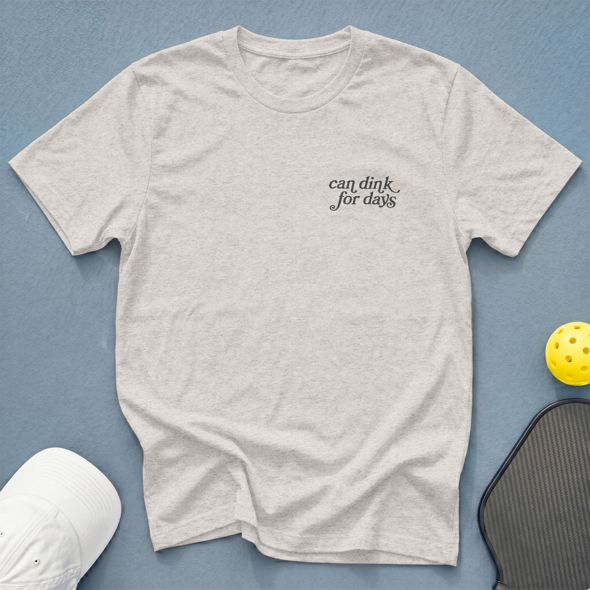Light gray t-shirt with "can dink for days" text, pickleball paddle, and ball.