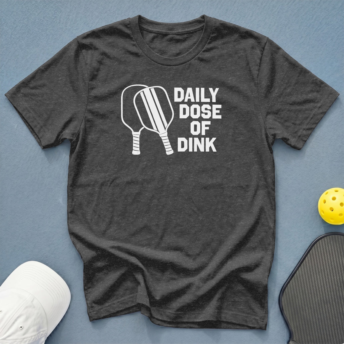 Dark grey t-shirt with white text and pickleball paddles: "Daily Dose of Dink".