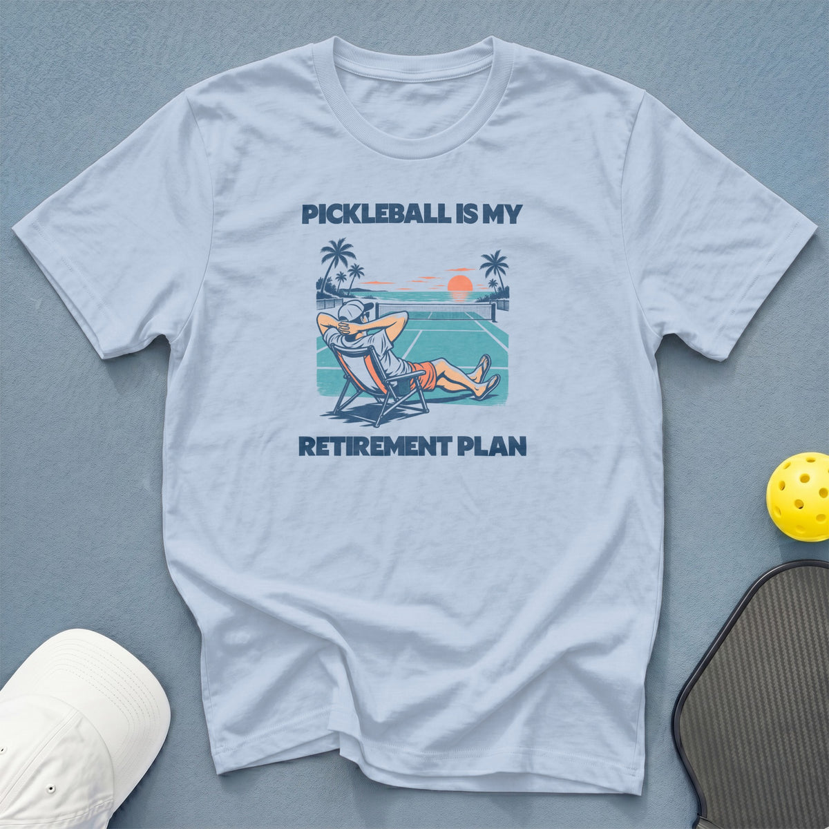 Light blue t-shirt with graphic: "Pickleball is my retirement plan."
