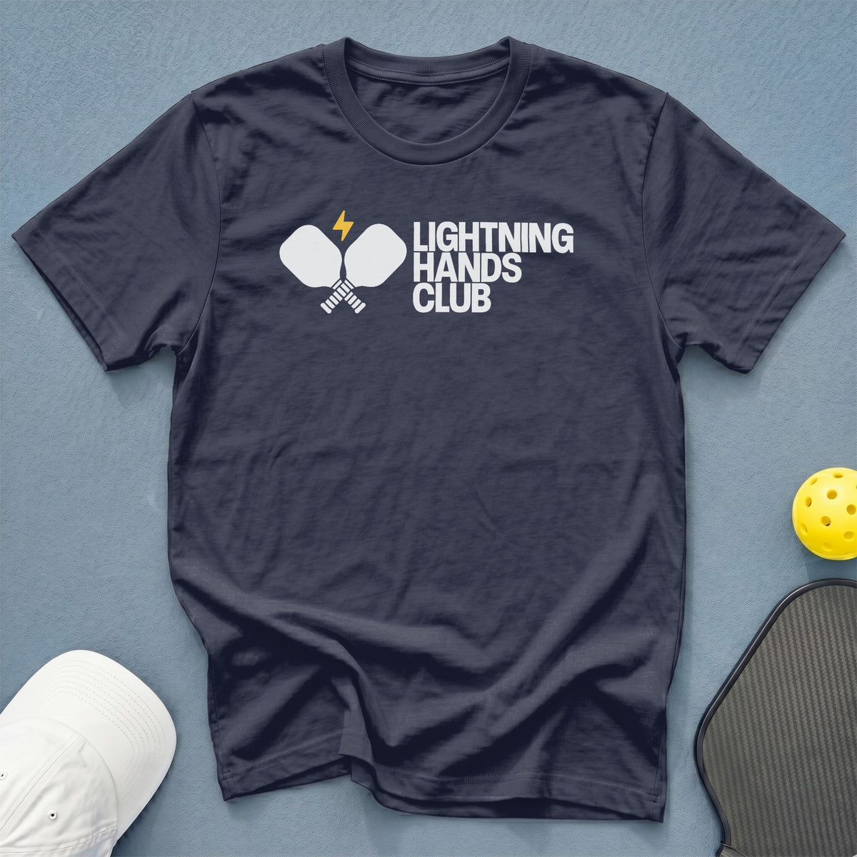 Navy t-shirt with "LIGHTNING HANDS CLUB" and crossed pickleball paddles logo.