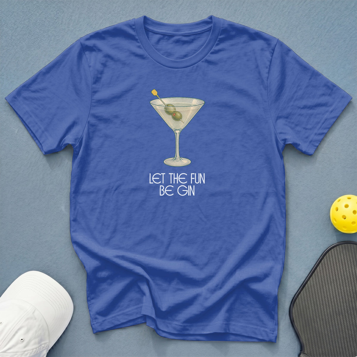 Blue t-shirt with a martini glass graphic and text "LET THE FUN BE GIN".