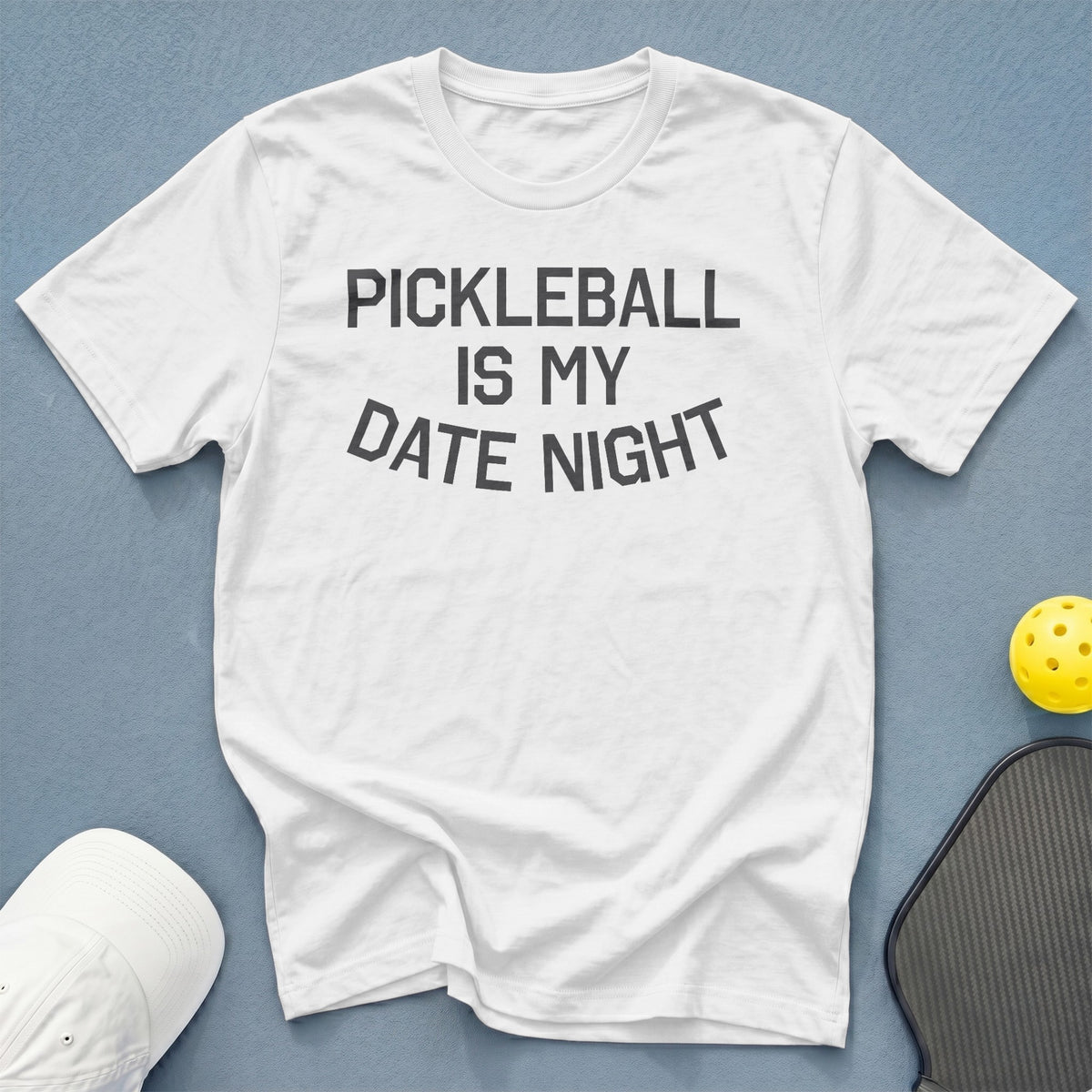 White t-shirt with "Pickleball Is My Date Night" text, pickleball, and paddle.