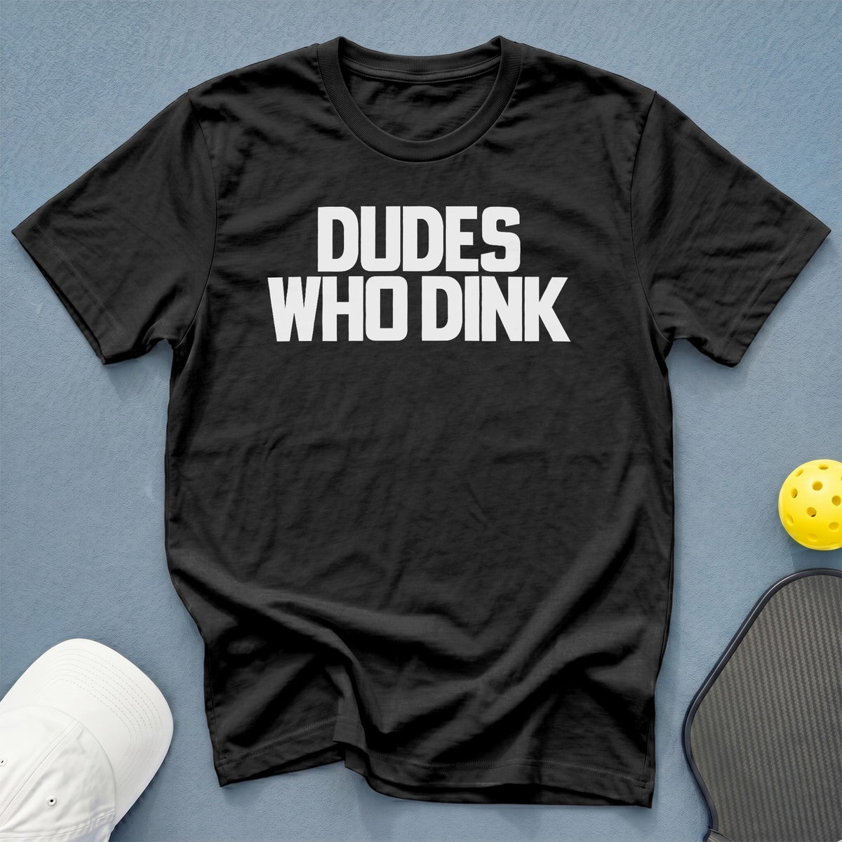 Black t-shirt with white text that reads "Dudes Who Dink".