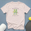 Light pink t-shirt with two frogs holding pickleball paddles and balls, text WANNA STACK?