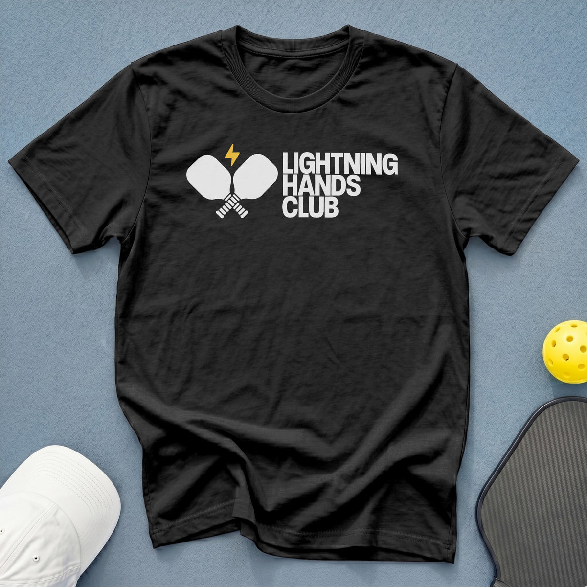 Black t-shirt with "Lightning Hands Club" logo featuring pickleball paddles and lightning bolt.