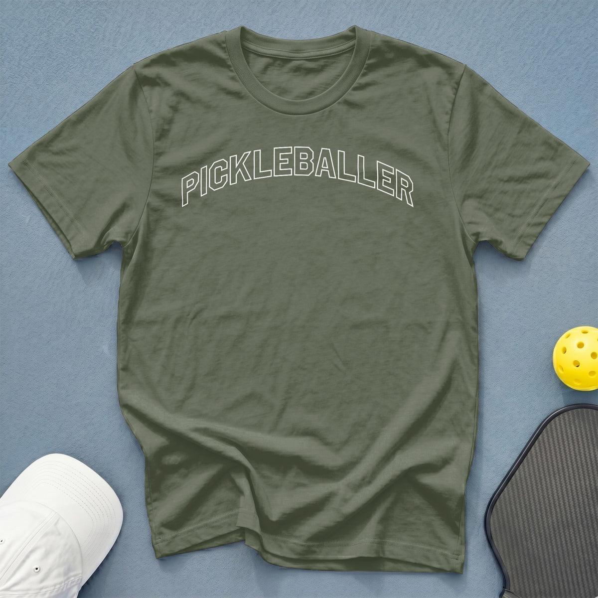 Olive green t-shirt with "PICKLEBALLER" text in white outline.