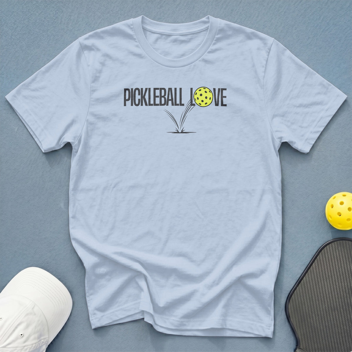 Light blue t-shirt with "PICKLEBALL LOVE" graphic and pickleball, paddle, and hat.