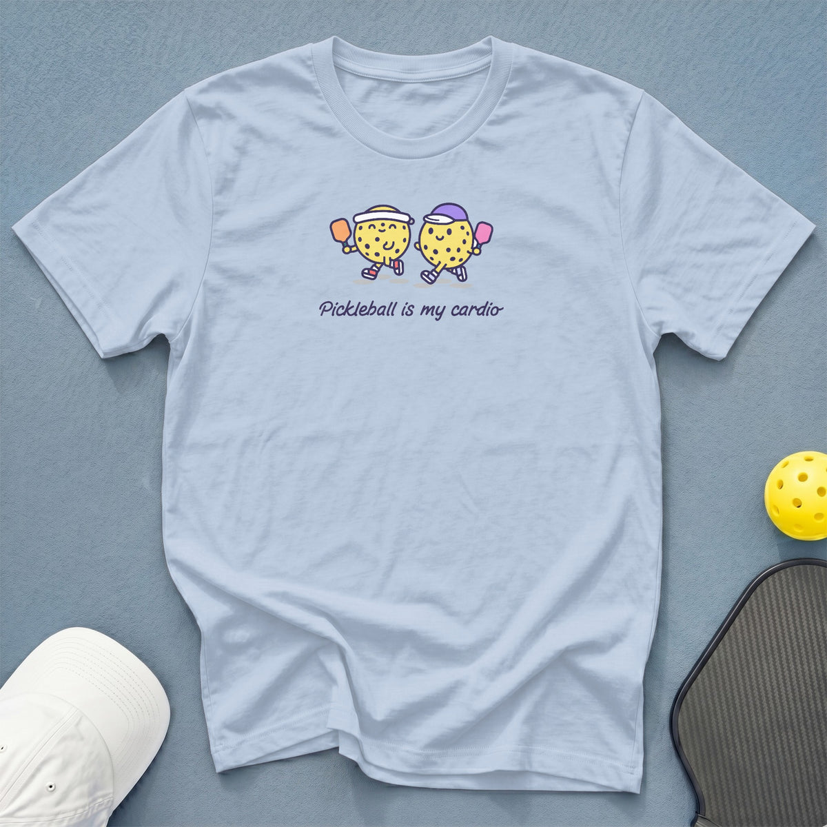 Light blue t-shirt with pickleballs playing pickleball and text "Pickleball is my cardio".