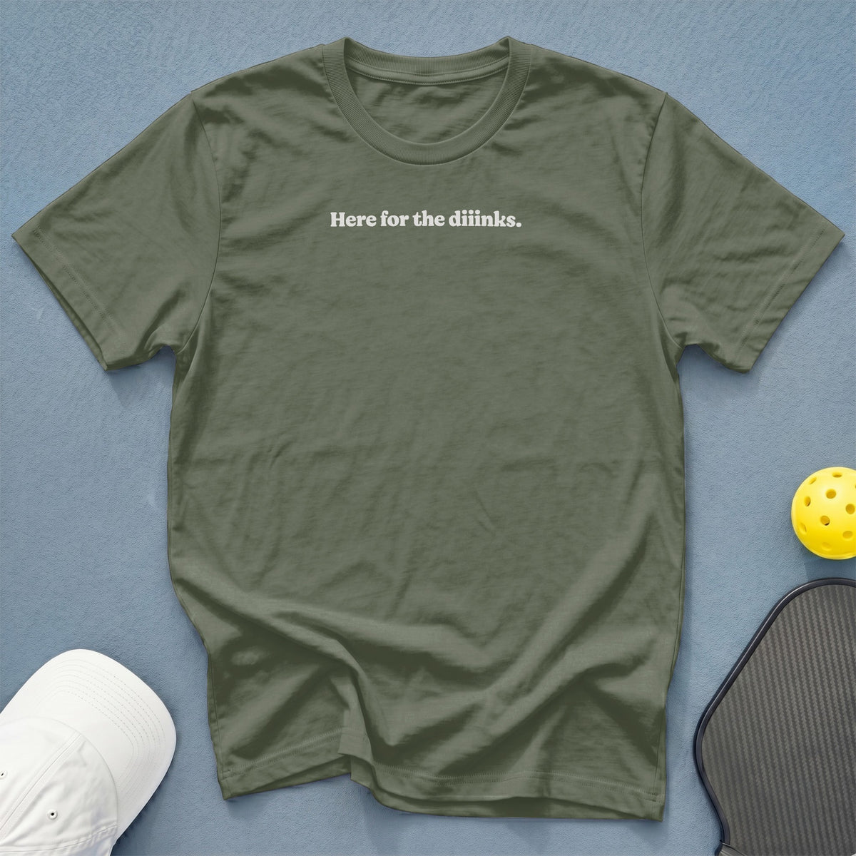 Olive green t-shirt with white text "Here for the diinks."