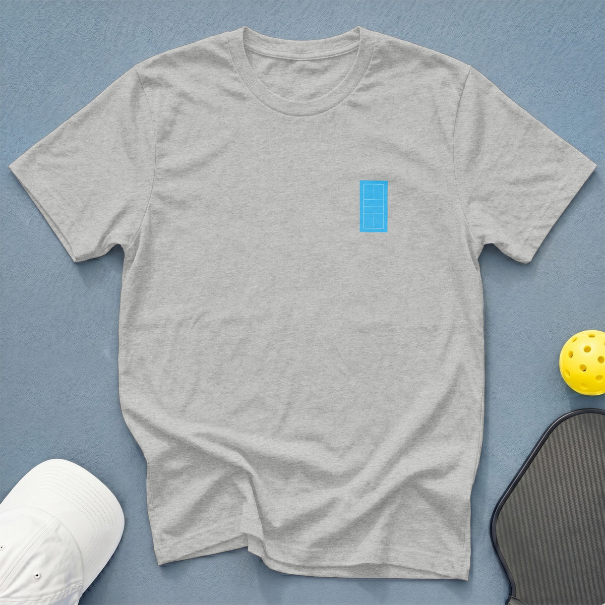 Light gray t-shirt with a small blue tennis court graphic on the left chest.