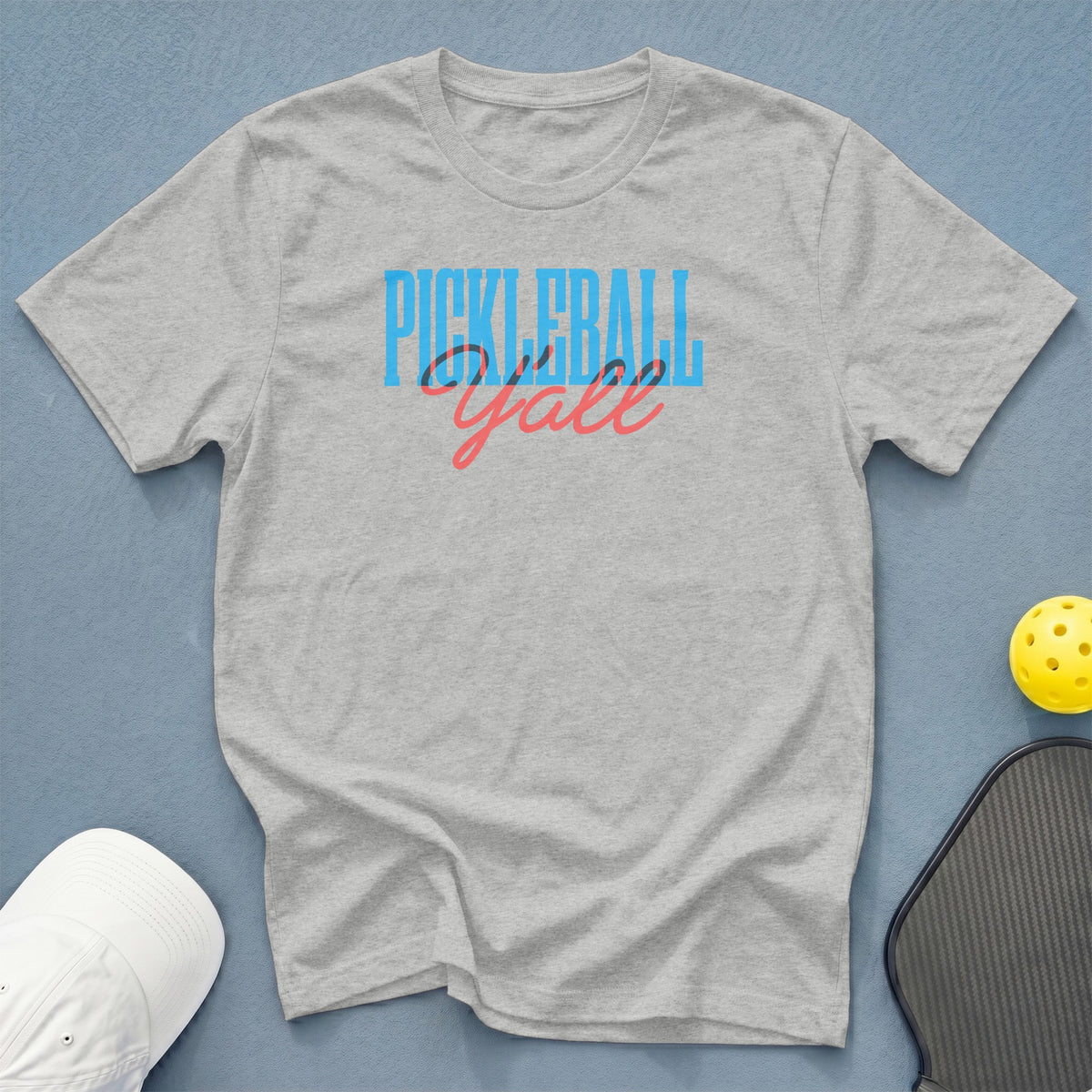 Grey t-shirt with "PICKLEBALL Y'all" text, a pickleball, and a paddle.