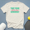Cream t-shirt with "Take Your Dinks Seriously" text, pickleball paddle, and ball.