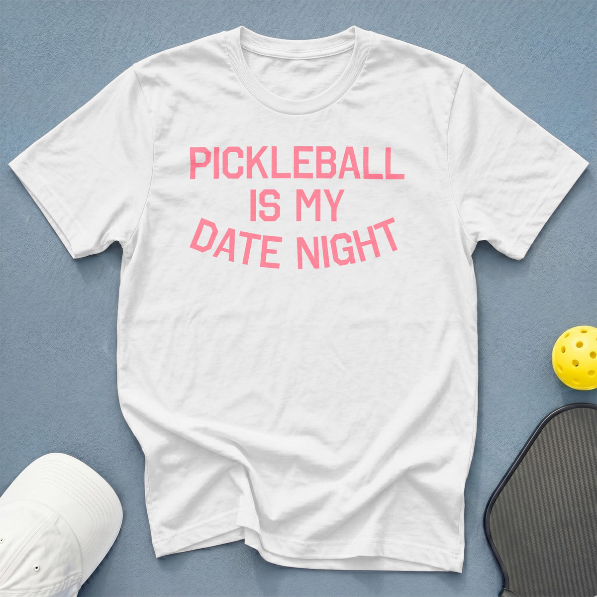 White t-shirt with pink text that reads "PICKLEBALL IS MY DATE NIGHT".