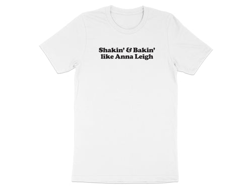 White t-shirt with black text "Shakin' & Bakin' like Anna Leigh."