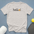 Light grey t-shirt with "hello!" and pickleball graphic, near pickleball paddle and cap.