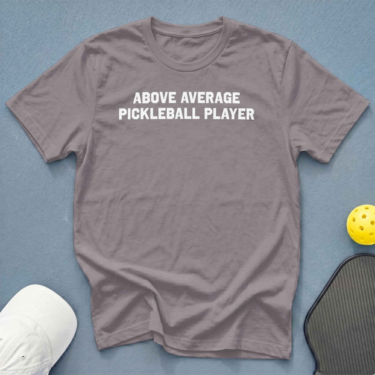 Grey t-shirt with white text "ABOVE AVERAGE PICKLEBALL PLAYER".