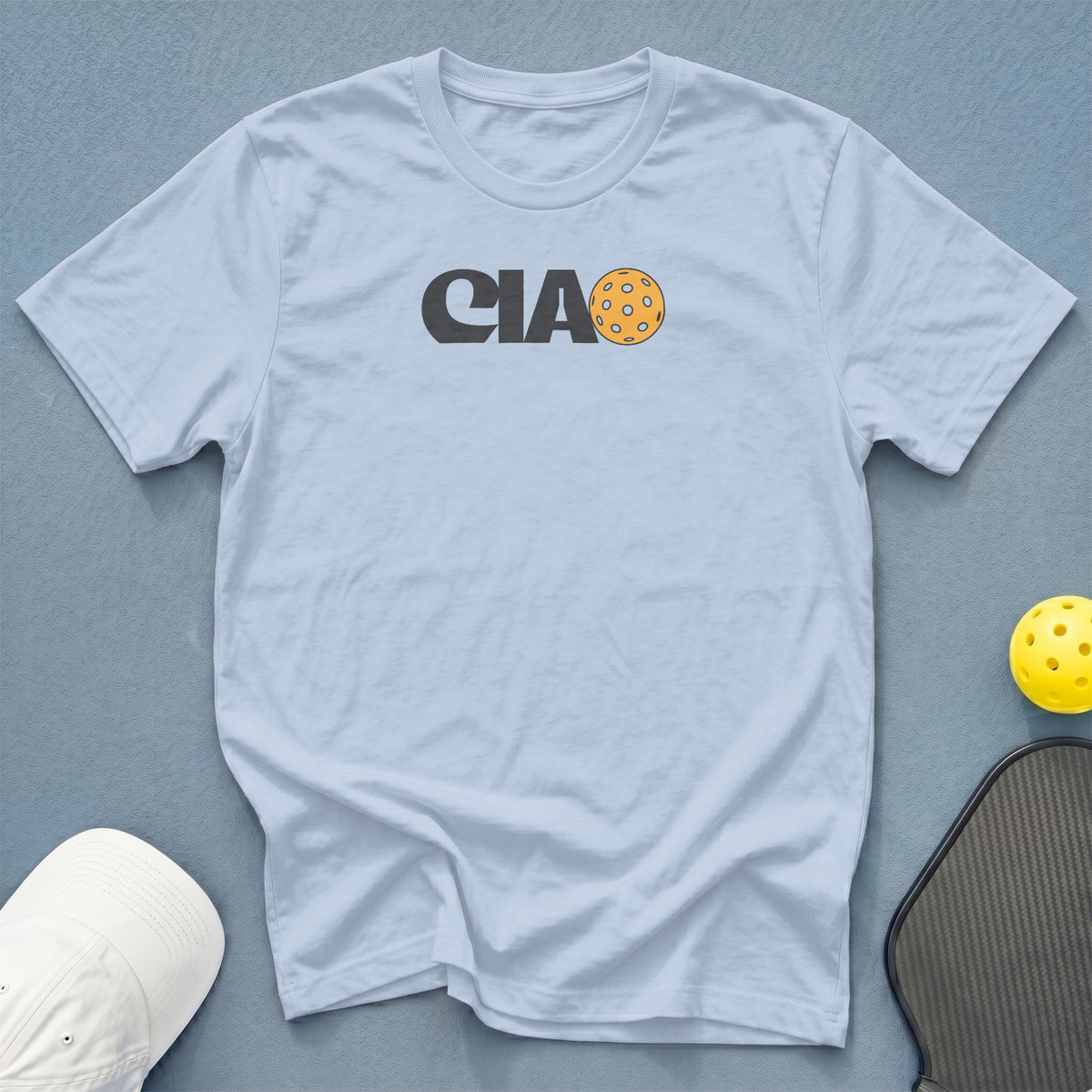 Light blue t-shirt with "CIAO" and a pickleball graphic on the chest.