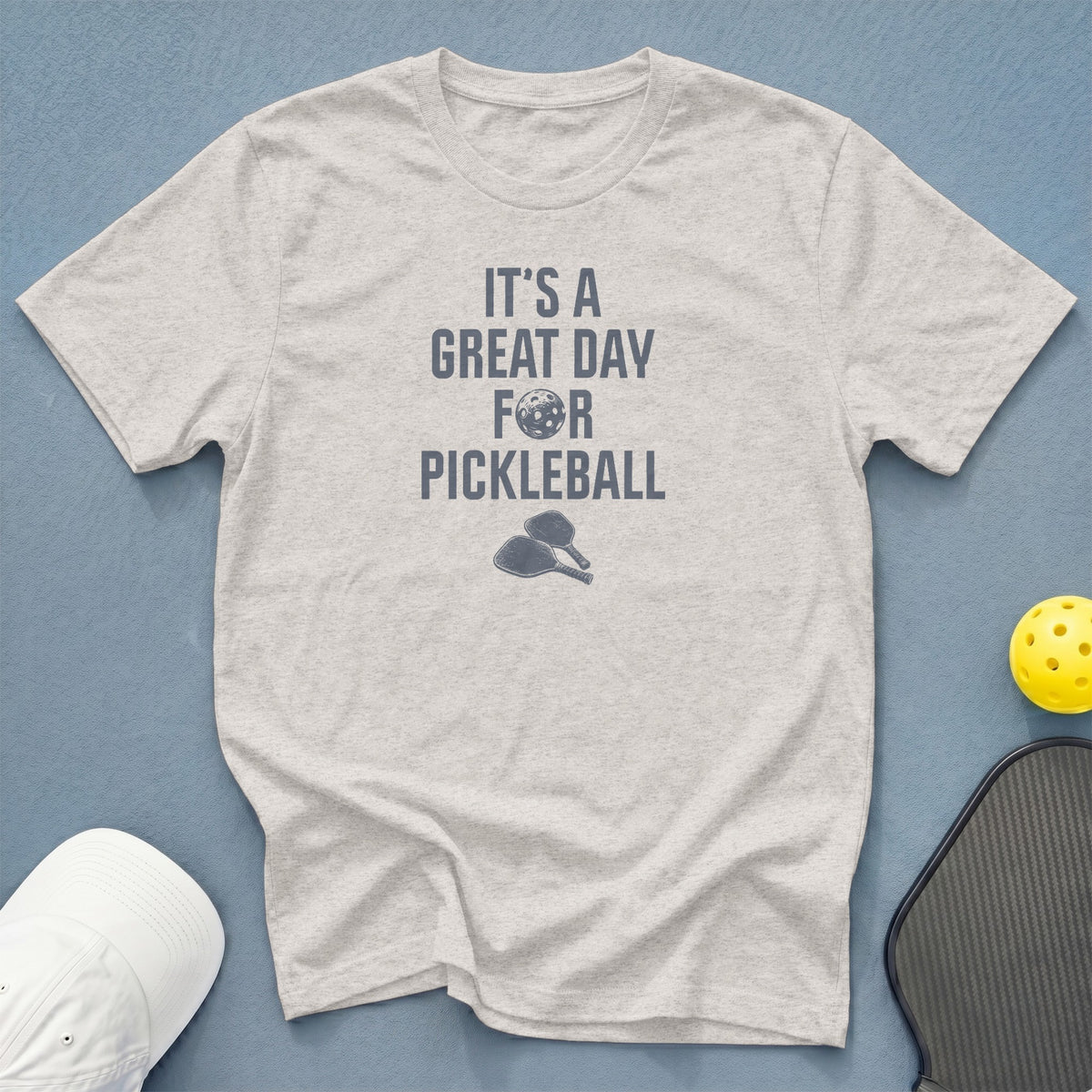 Light gray t-shirt with "It's a Great Day For Pickleball" text and graphics.
