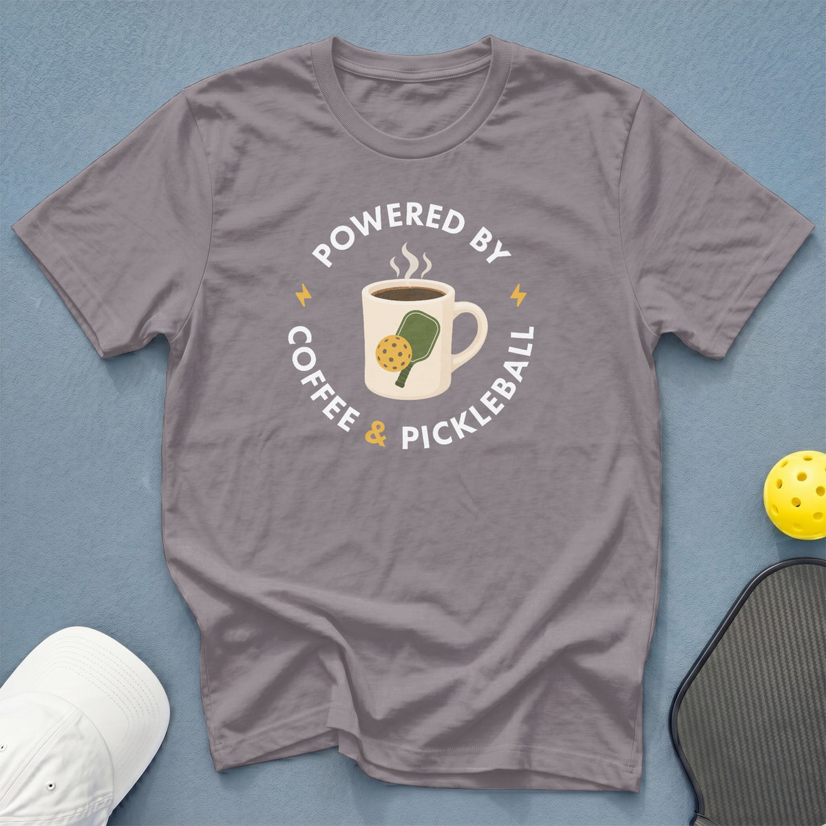 Gray t-shirt with "Powered by Coffee & Pickleball" graphic featuring a coffee mug.