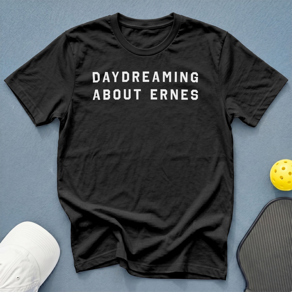 Black t-shirt with white text "DAYDREAMING ABOUT ERNES".