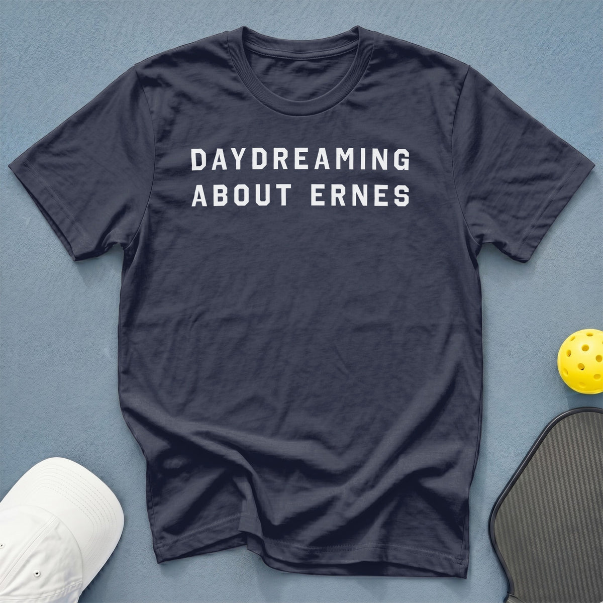 Navy t-shirt with white text "DAYDREAMING ABOUT ERNES".
