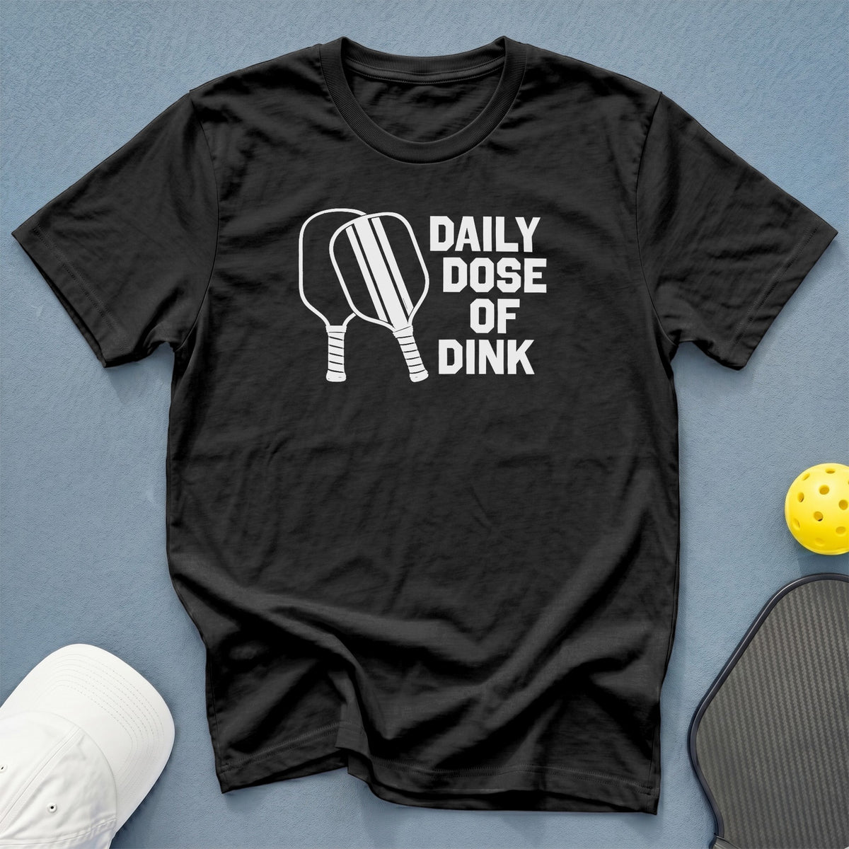 Black t-shirt with white text and graphics "DAILY DOSE OF DINK".