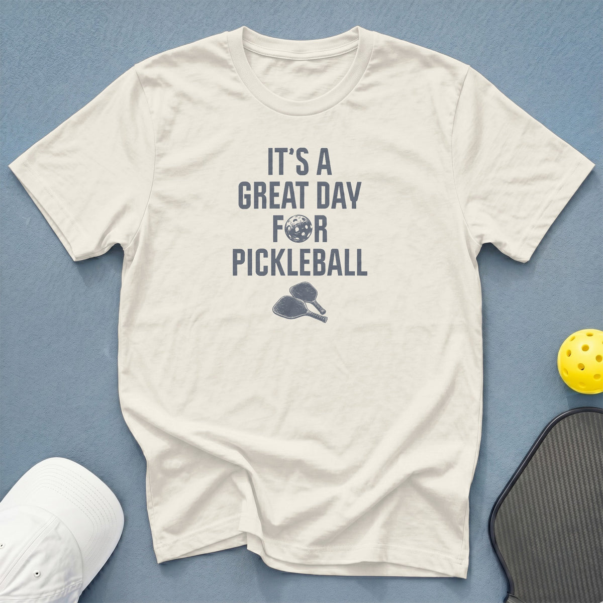 Cream t-shirt with "It's a Great Day for Pickleball" text and graphics.
