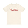 Cream t-shirt with red text "Soft Dinks & Hard Drives".
