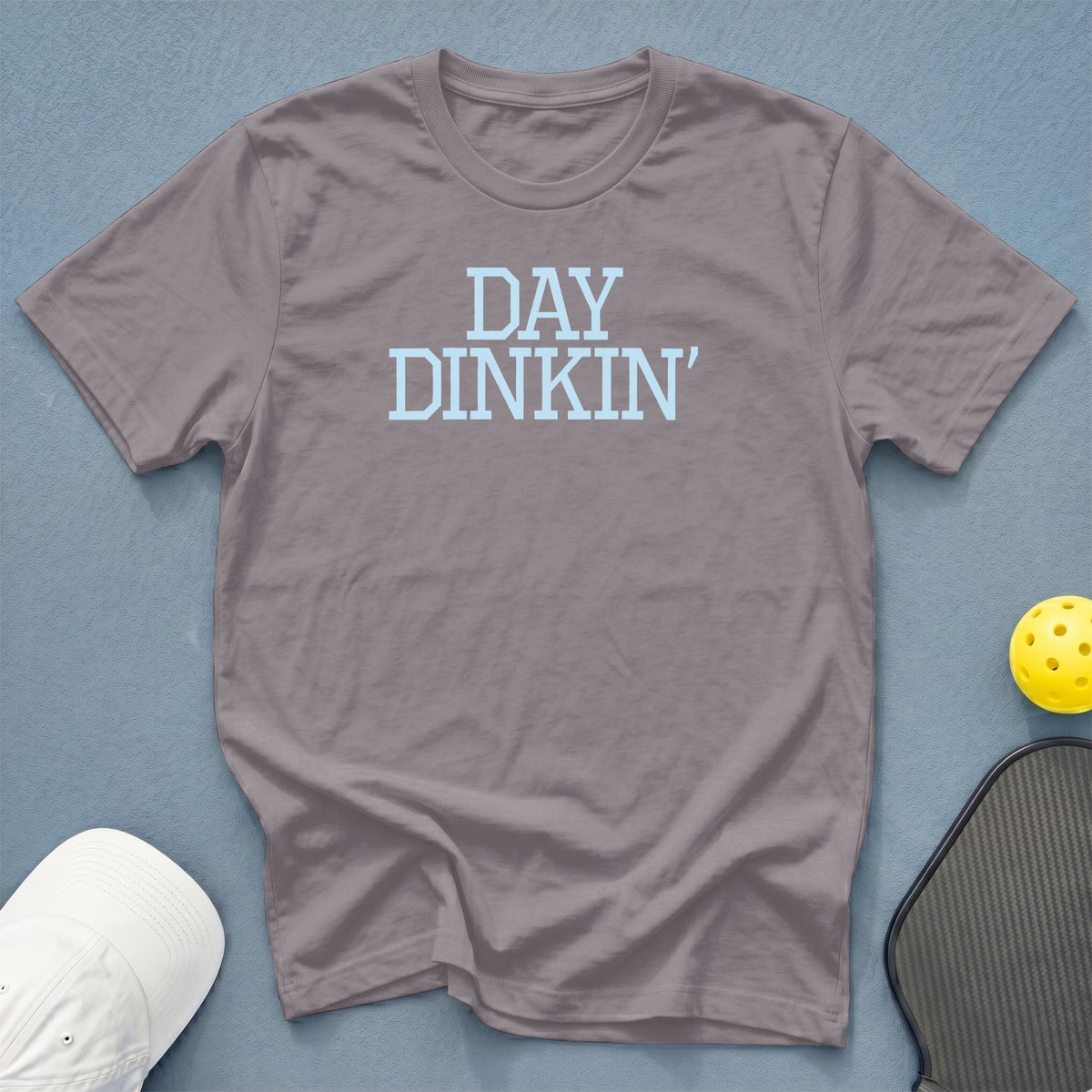 Gray t-shirt with "DAY DINKIN'" text and pickleball paddle and ball.