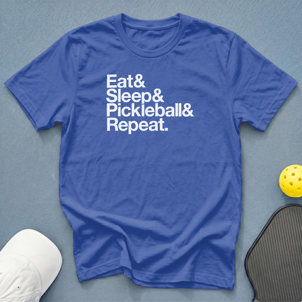 Blue t-shirt with white text "Eat & Sleep & Pickleball & Repeat."