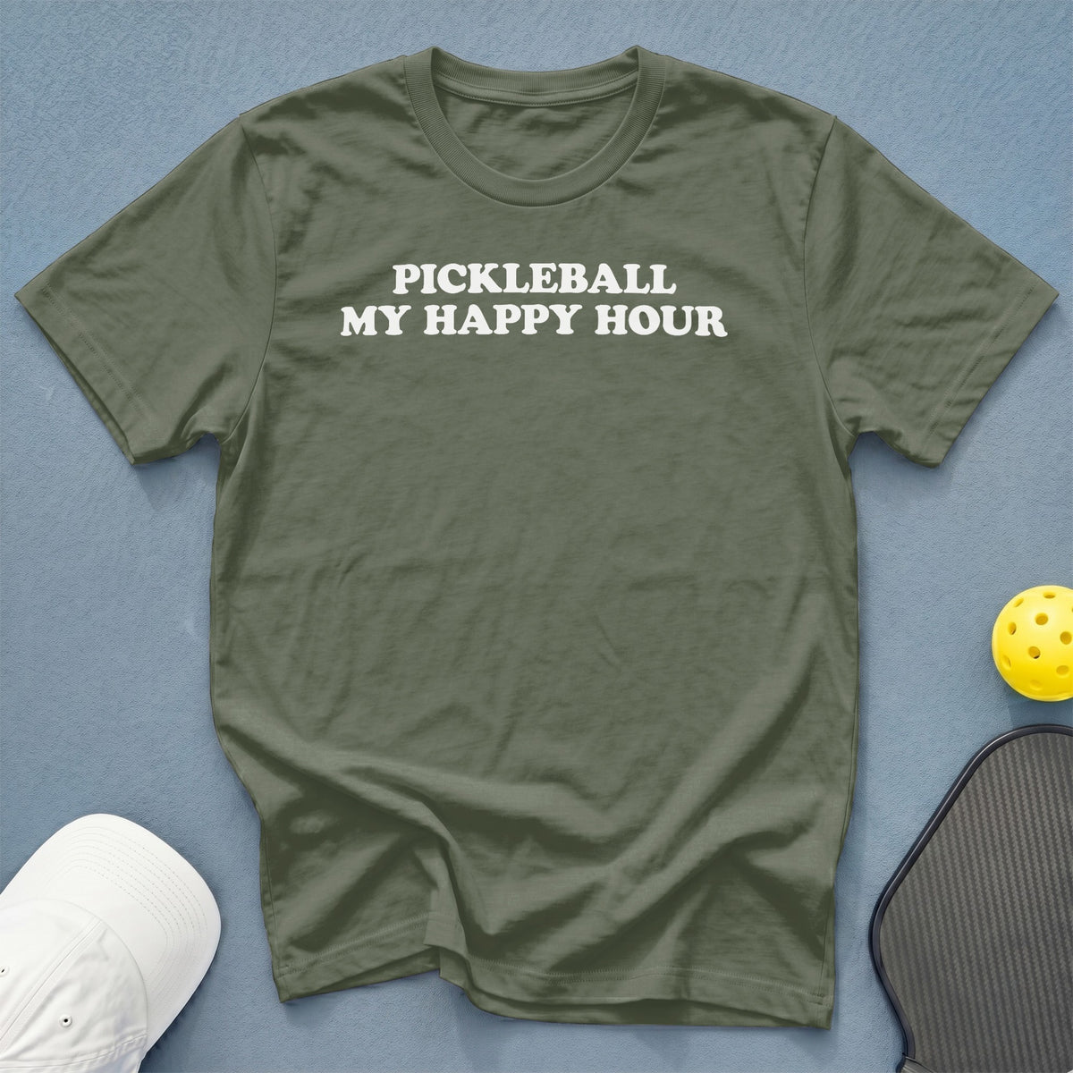 Green t-shirt with white text "PICKLEBALL MY HAPPY HOUR", yellow ball, and pickleball paddle.