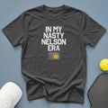 Dark grey t-shirt with "IN MY NASTY NELSON ERA" and a pickleball in a net.